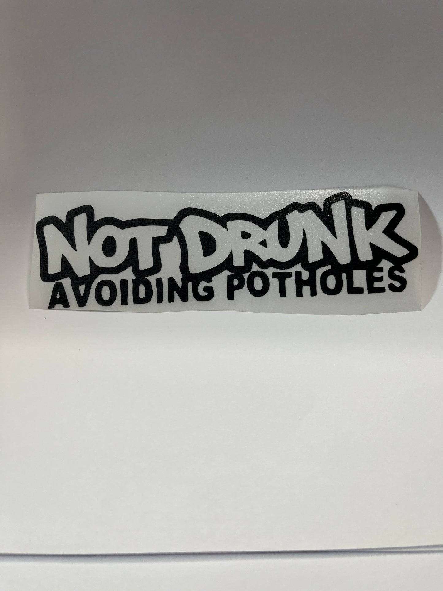 NOT DRUNK AVOIDING POTHOLES