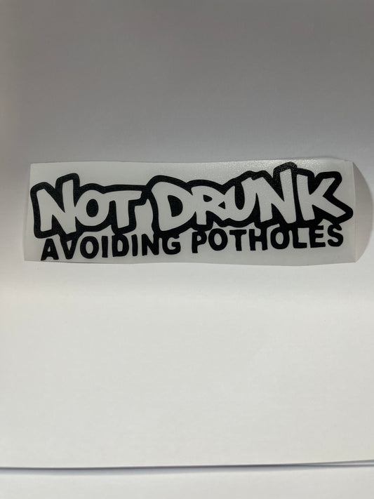 NOT DRUNK AVOIDING POTHOLES